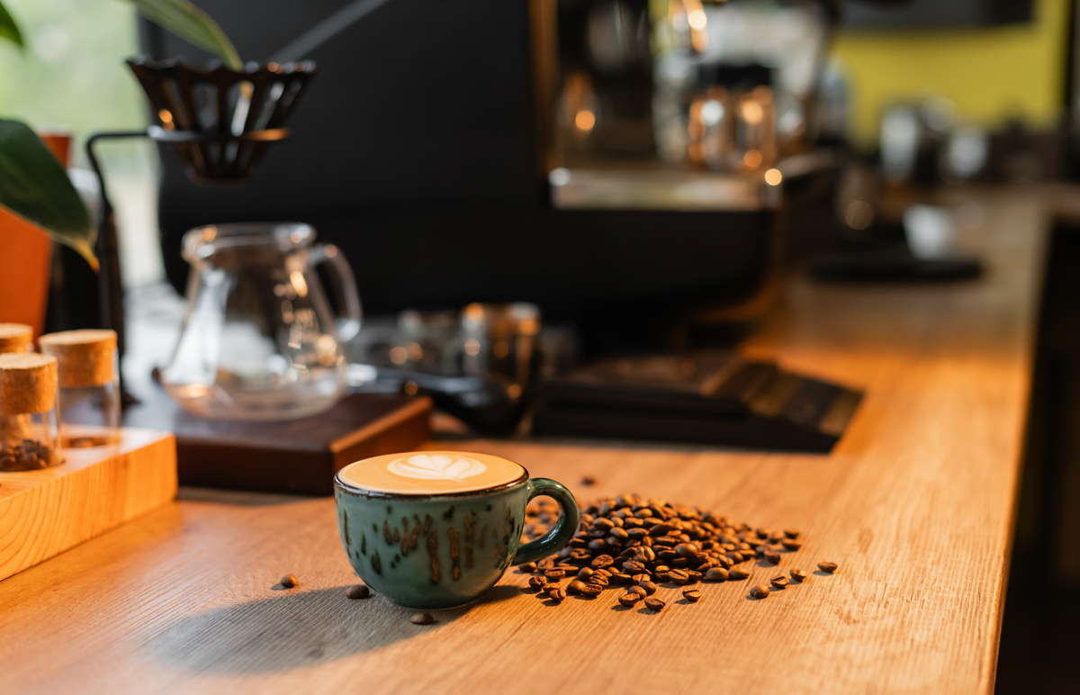 Espresso pouring from a portafilter into a glass