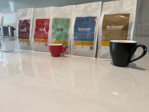 Highest Good coffee range lined up on a kitchen bench, The Grounded in front