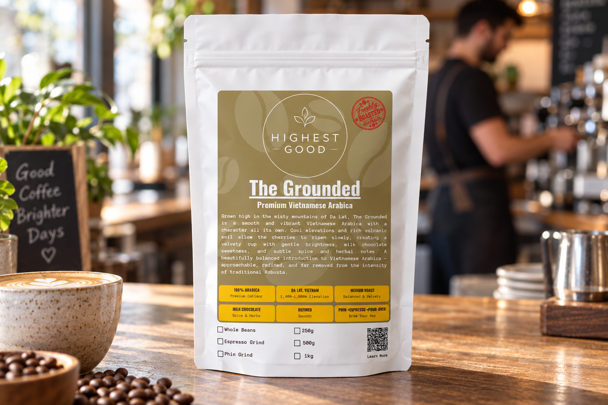 Highest Good The Grounded Vietnamese Arabica coffee pouch on a cafe counter