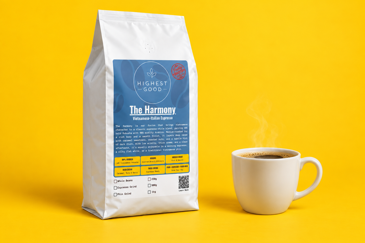 Highest Good The Harmony espresso blend pouch next to a mug of black coffee